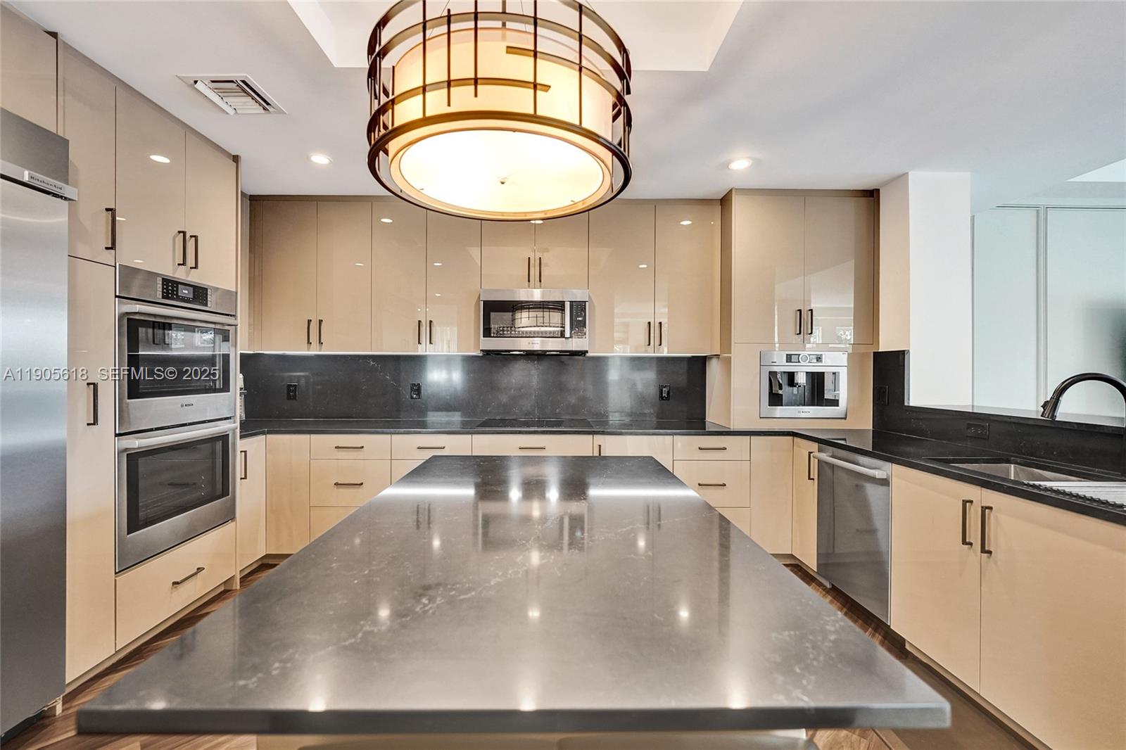 516 Hendricks Isle, Unit 2C Fort Lauderdale, FL 33301 - Photo 12 of 77 a large kitchen with stainless steel appliances a large counter top