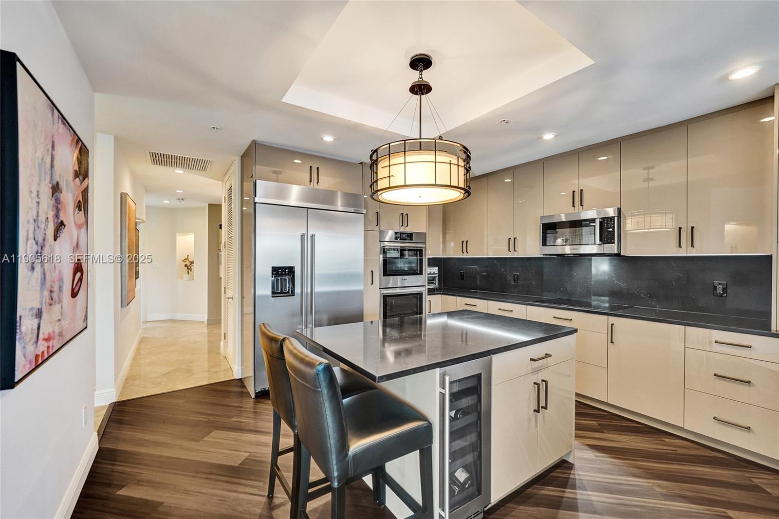 516 Hendricks Isle, Unit 2C Fort Lauderdale, FL 33301 - Photo 13 of 77 a kitchen with stainless steel appliances granite countertop a sink a refrigerator and a granite counter tops
