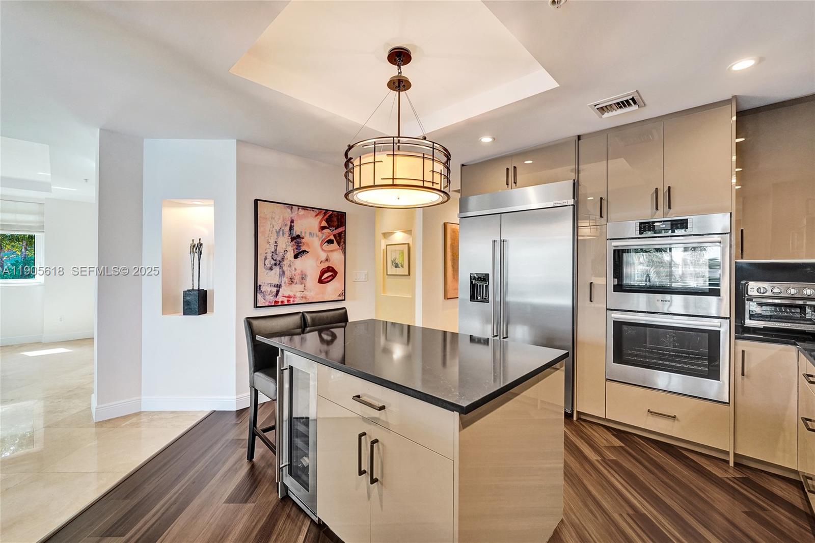 516 Hendricks Isle, Unit 2C Fort Lauderdale, FL 33301 - Photo 16 of 77 a kitchen with stainless steel appliances granite countertop a stove and a refrigerator