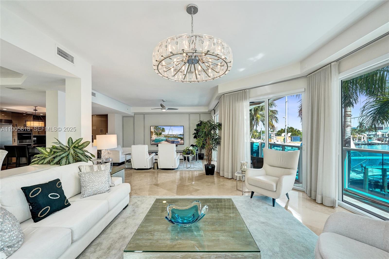 516 Hendricks Isle, Unit 2C Fort Lauderdale, FL 33301 - Photo 31 of 77 a living room with furniture and a large window