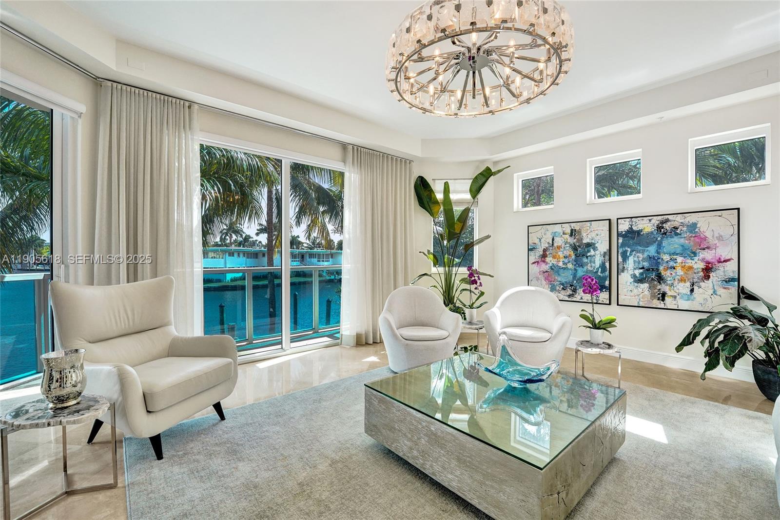 516 Hendricks Isle, Unit 2C Fort Lauderdale, FL 33301 - Photo 34 of 77 a living room with furniture a table and a large window