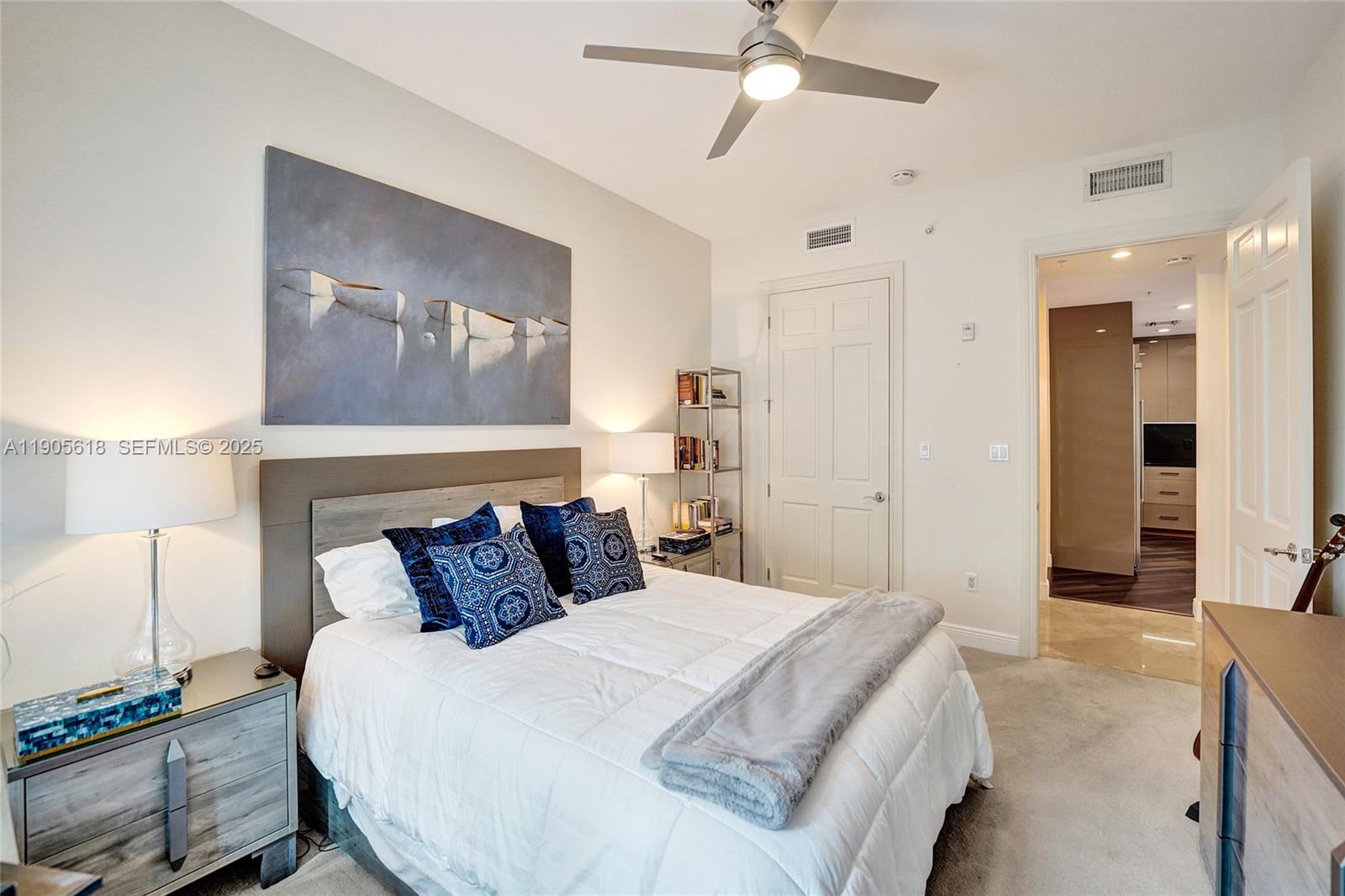 516 Hendricks Isle, Unit 2C Fort Lauderdale, FL 33301 - Photo 47 of 77 a bedroom with a bed and a painting on the wall