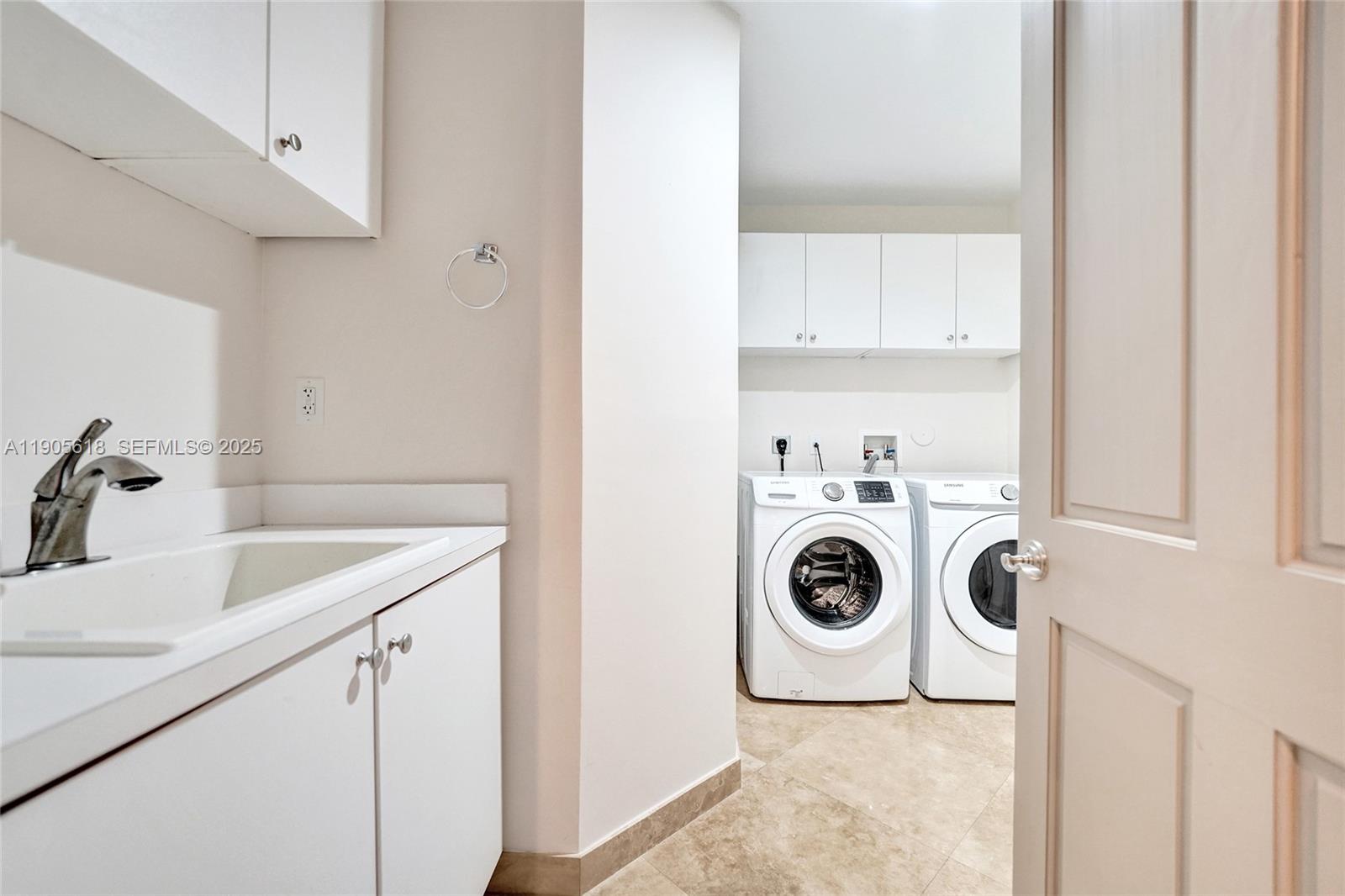516 Hendricks Isle, Unit 2C Fort Lauderdale, FL 33301 - Photo 53 of 77 a utility room with sink dryer and washer