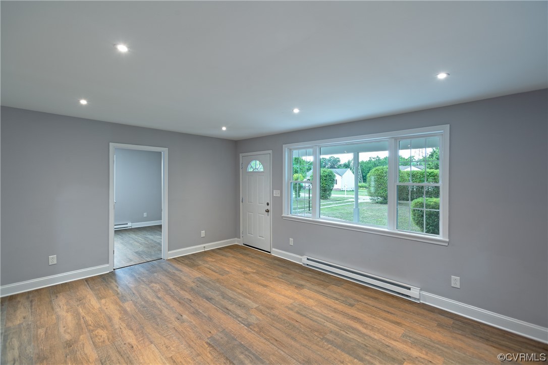 2440 Dupuy Road Petersburg, VA 23803 - Photo 11 of 25 an empty room with wooden floor and windows