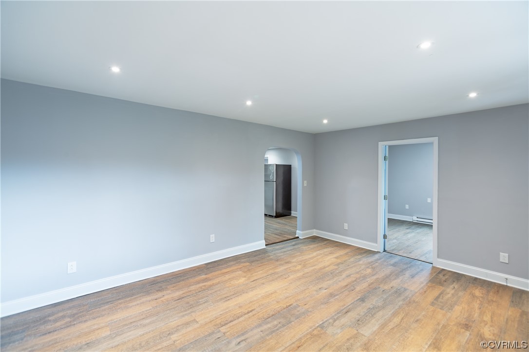 2440 Dupuy Road Petersburg, VA 23803 - Photo 12 of 25 an empty room with wooden floor and windows