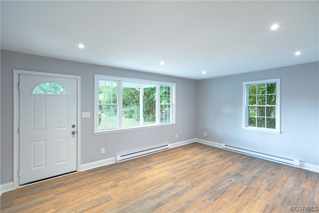 2440 Dupuy Road Petersburg, VA 23803 - Photo 14 of 25 an empty room with wooden floor and windows