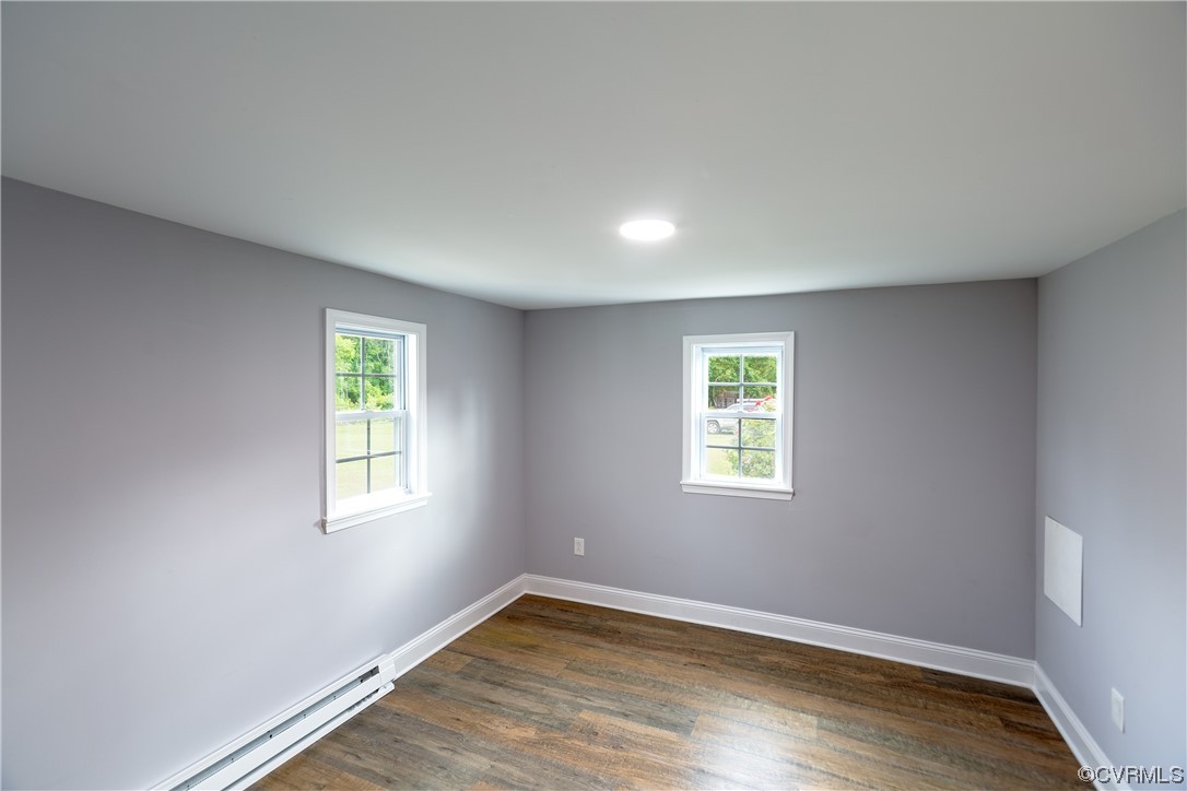 2440 Dupuy Road Petersburg, VA 23803 - Photo 19 of 25 a view of an empty room with wooden floor and a window