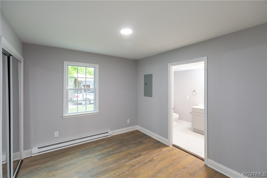 2440 Dupuy Road Petersburg, VA 23803 - Photo 20 of 25 an empty room with wooden floor and windows