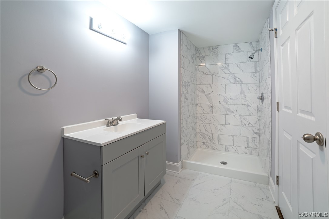 2440 Dupuy Road Petersburg, VA 23803 - Photo 22 of 25 a bathroom with a shower a mirror and a sink
