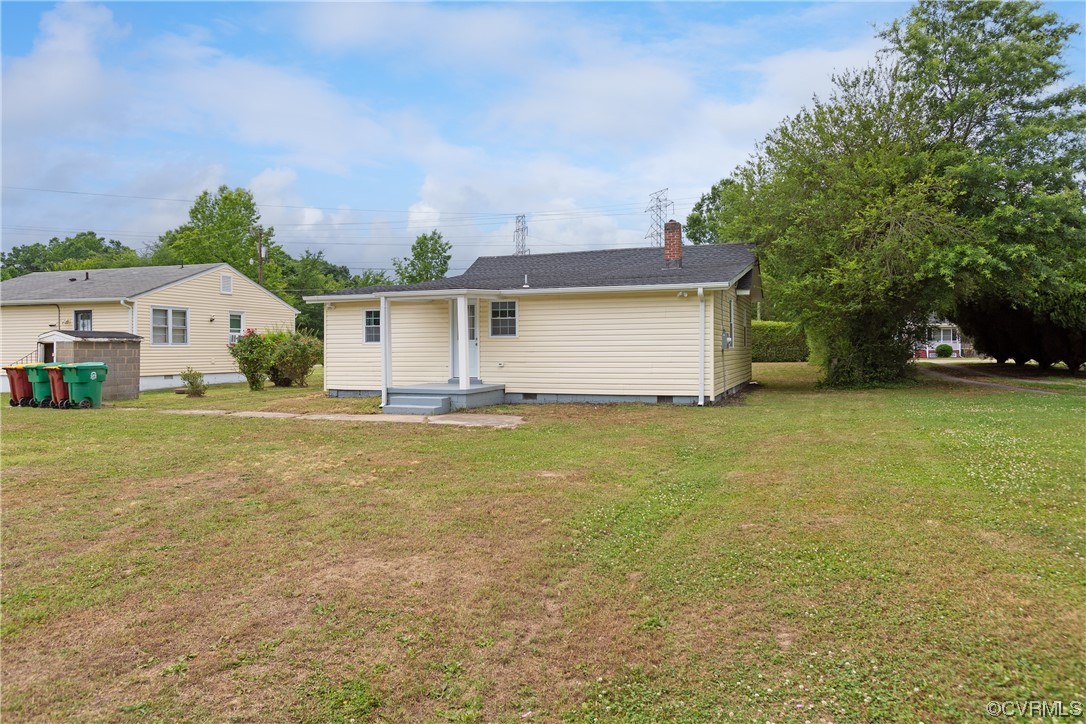 2440 Dupuy Road Petersburg, VA 23803 - Photo 4 of 25 a front view of a house with a yard and garage