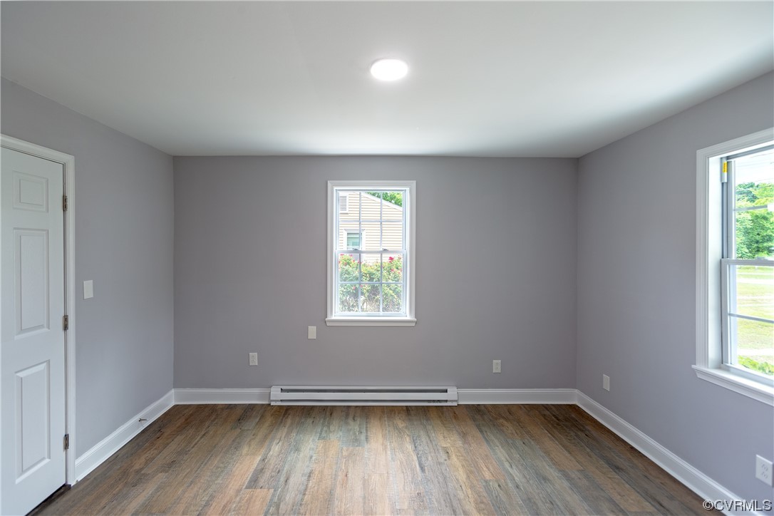 2440 Dupuy Road Petersburg, VA 23803 - Photo 8 of 25 an empty room with wooden floor and windows