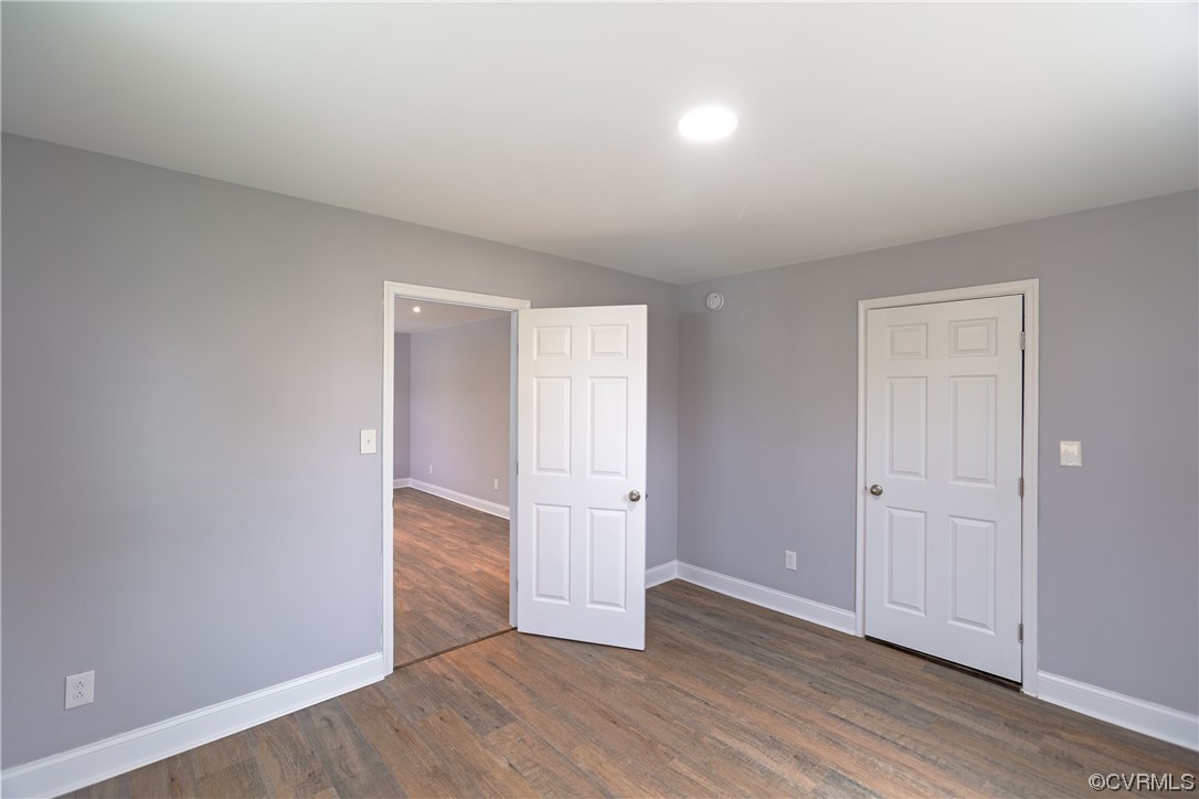 2440 Dupuy Road Petersburg, VA 23803 - Photo 10 of 25 an empty room with wooden floor & windows