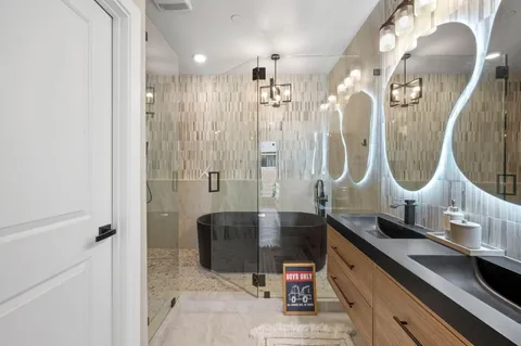 a bathroom with sinks and mirror