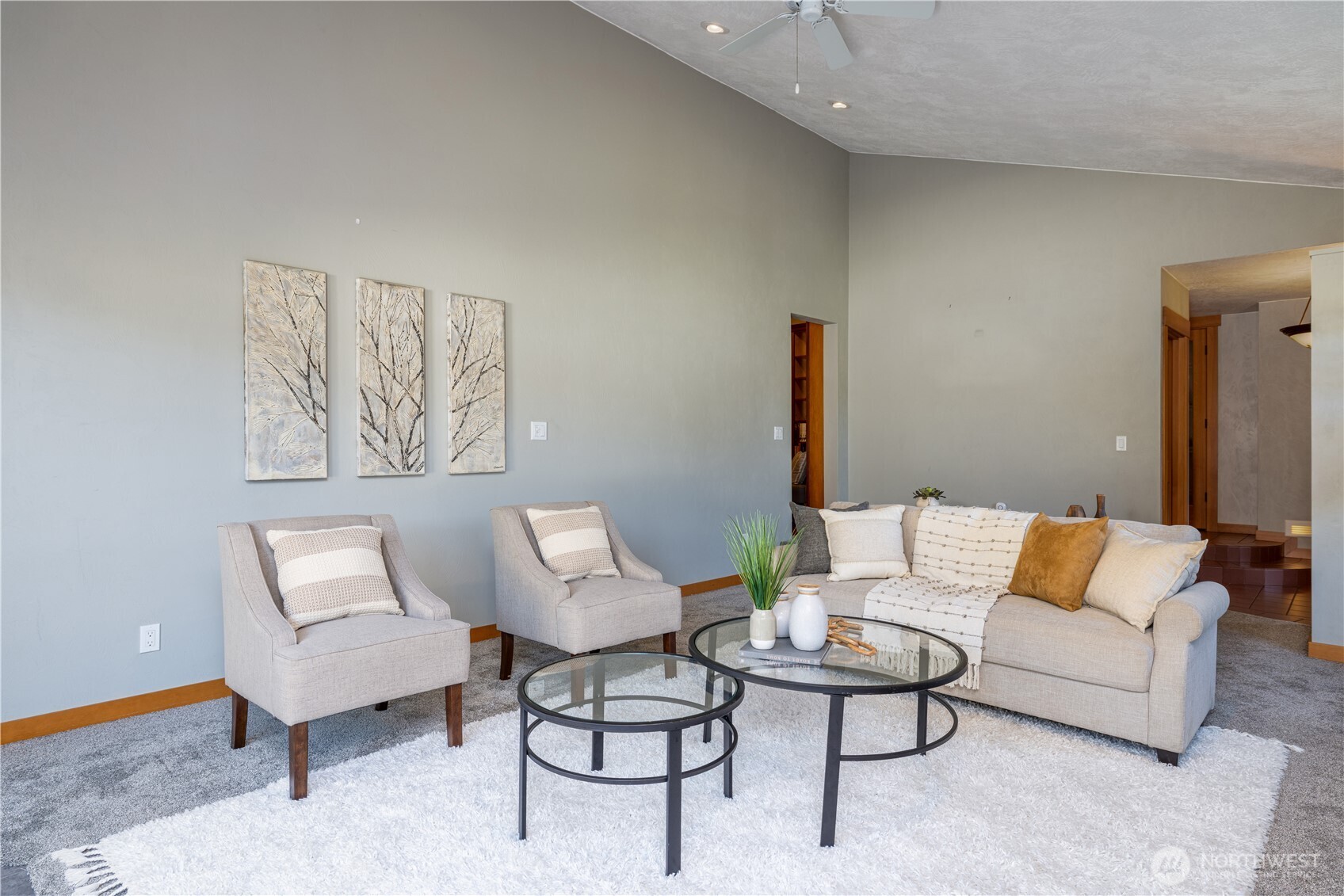 5981 Southeast Arcadia Road Shelton, WA 98584 - Photo 12 of 35 a living room with furniture a rug and a wall painting