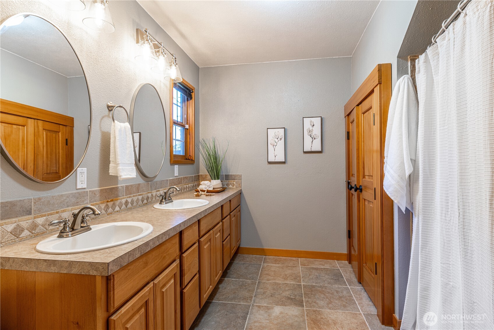 5981 Southeast Arcadia Road Shelton, WA 98584 - Photo 14 of 35 a bathroom with a sink and a mirror