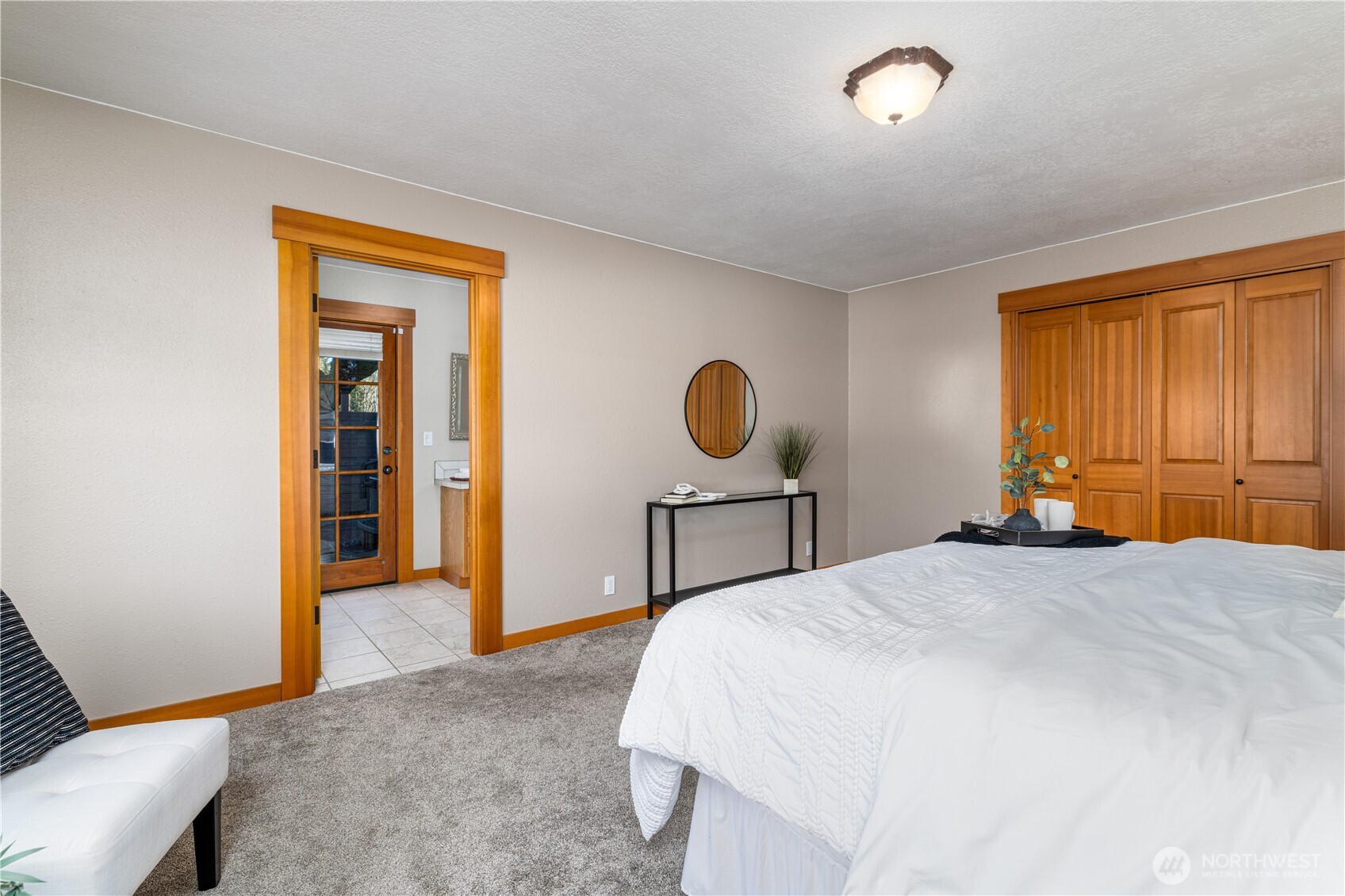 5981 Southeast Arcadia Road Shelton, WA 98584 - Photo 16 of 35 a bedroom with a bed and a table