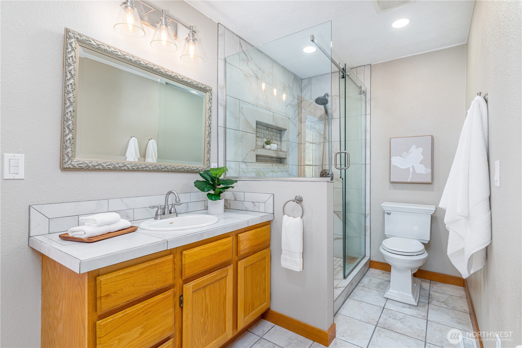 5981 Southeast Arcadia Road Shelton, WA 98584 - Photo 17 of 35 a bathroom with a sink a toilet and mirror