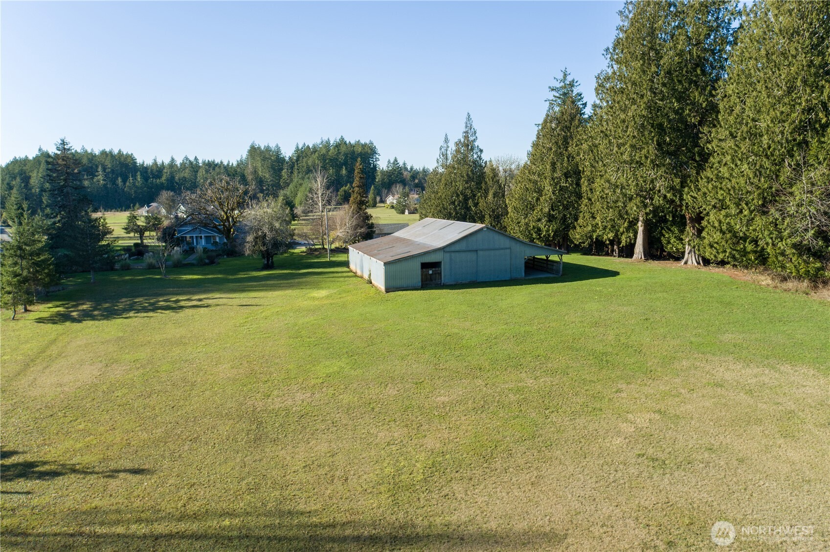 5981 Southeast Arcadia Road Shelton, WA 98584 - Photo 26 of 35 a view of a swimming pool with an outdoor space and seating area