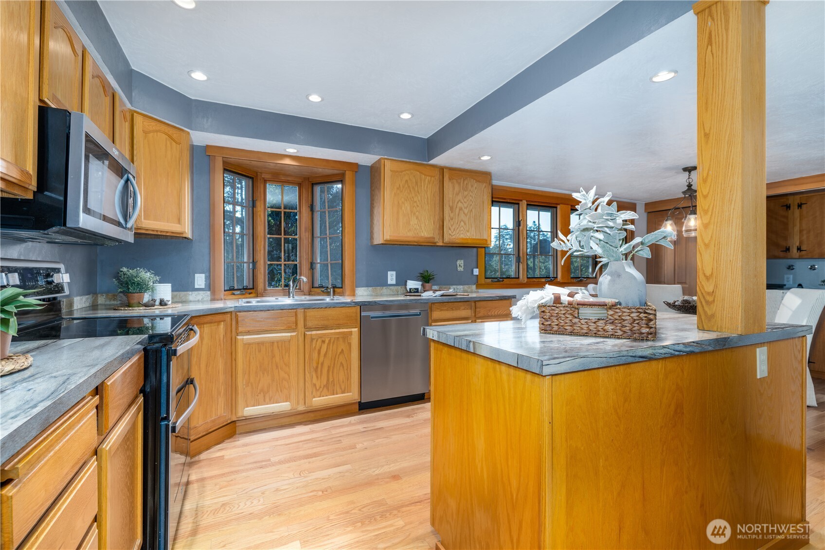 5981 Southeast Arcadia Road Shelton, WA 98584 - Photo 7 of 35 a kitchen with stainless steel appliances granite countertop sink stove and refrigerator