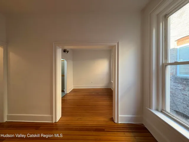 a kitchen with a sink and white cabinets