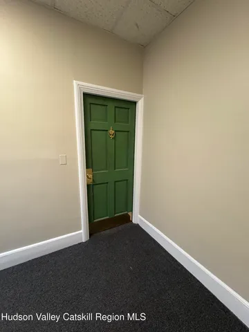 an empty room with an entryway door