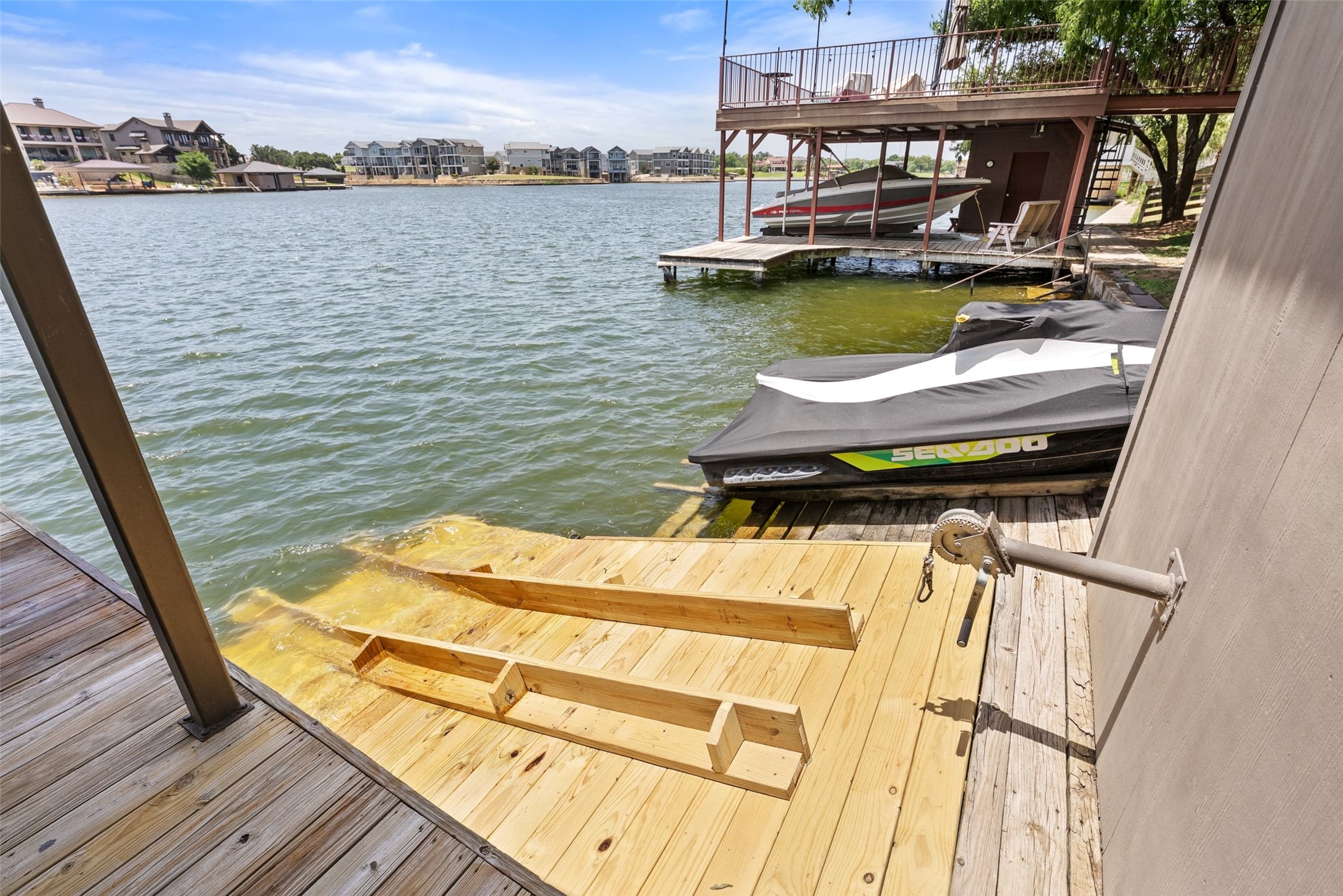 141 Perry Lane Kingsland, TX 78639 - Photo 12 of 40 A private boat dock and lift offer immediate access to lakeside recreation.