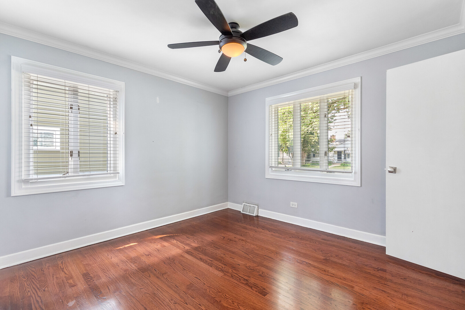 17 North Pine Street Mount Prospect, IL 60056 - Photo 13 of 32 a view of an empty room with wooden floor and a window