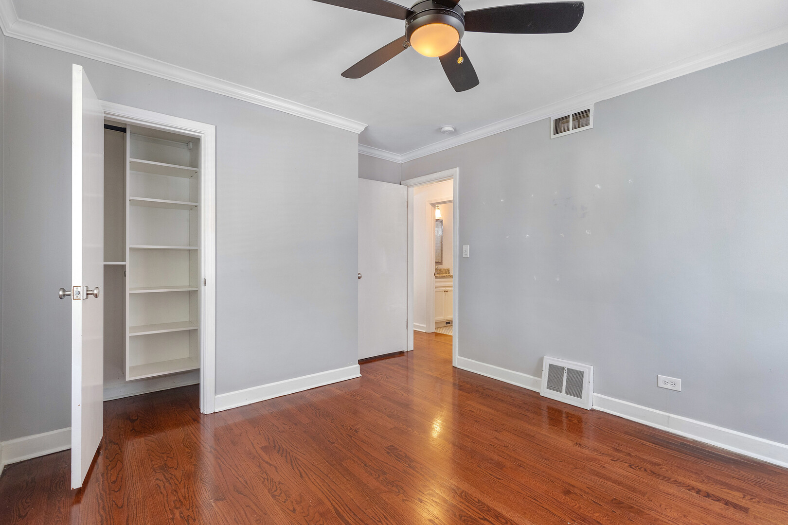 17 North Pine Street Mount Prospect, IL 60056 - Photo 14 of 32 an empty room with wooden floor closet and windows