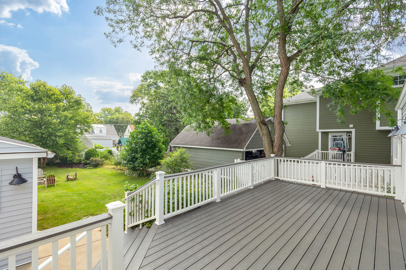 17 North Pine Street Mount Prospect, IL 60056 - Photo 24 of 32 a view of a deck with chairs and a yard with wooden fence