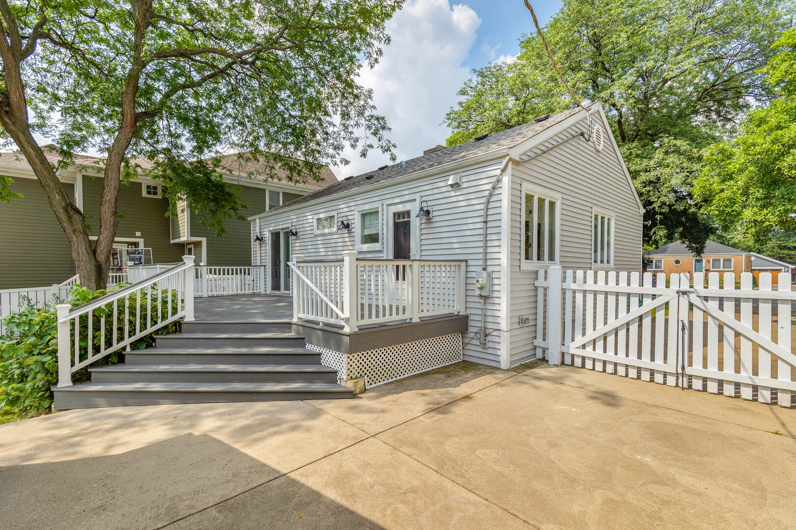 17 North Pine Street Mount Prospect, IL 60056 - Photo 26 of 32 a view of a house with wooden fence and large trees