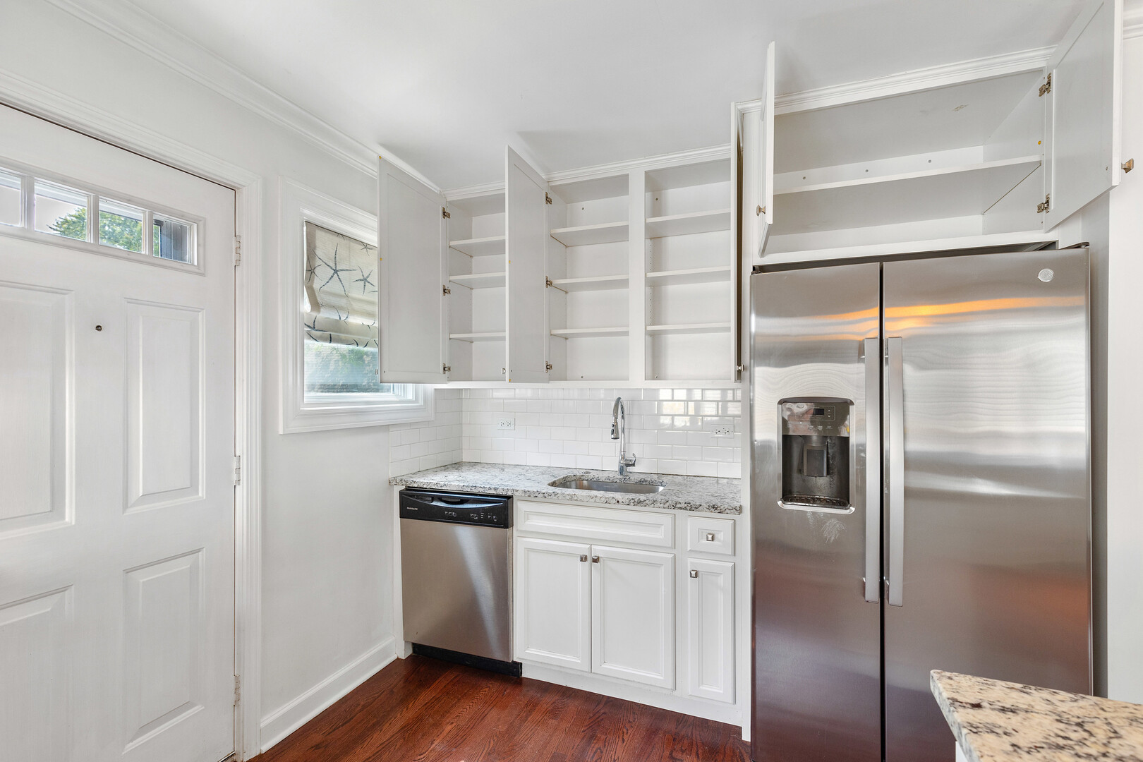 17 North Pine Street Mount Prospect, IL 60056 - Photo 8 of 32 a kitchen with a refrigerator a sink and cabinets