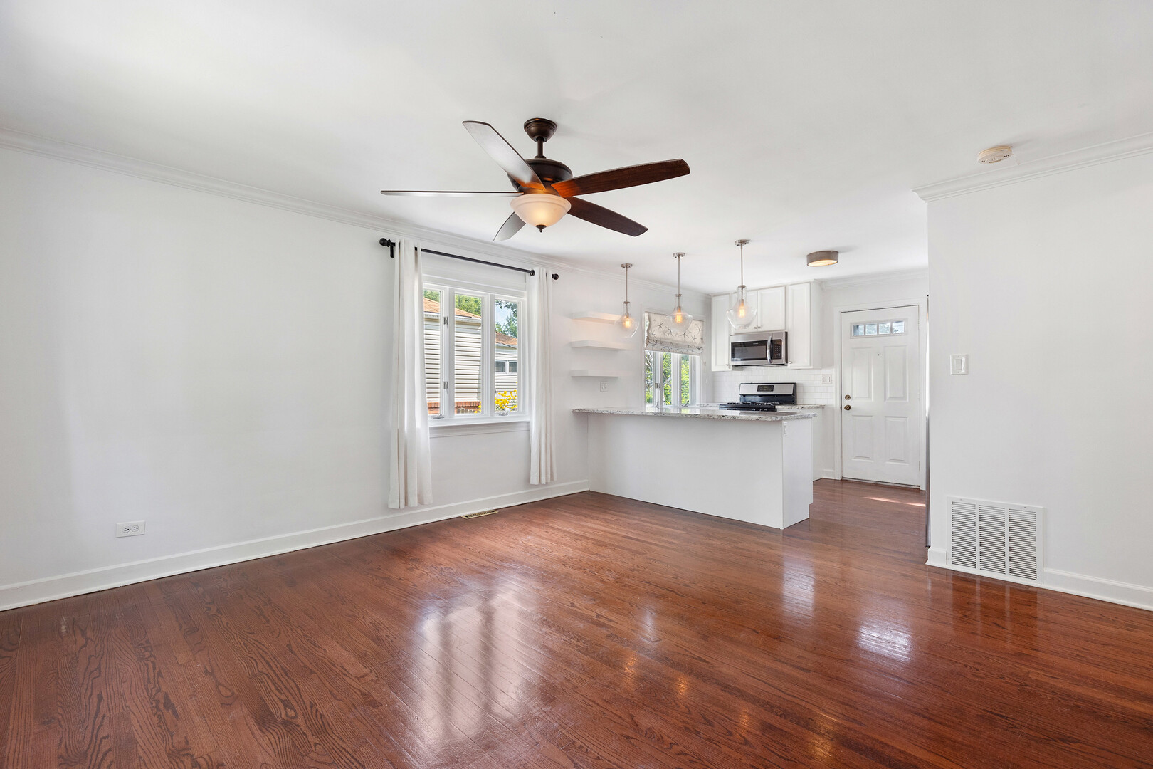 17 North Pine Street Mount Prospect, IL 60056 - Photo 9 of 32 a view of a kitchen with wooden floor and a kitchen