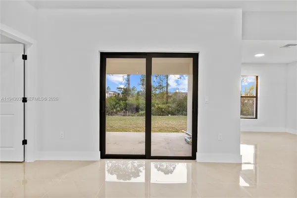 a view of a room that has a large window