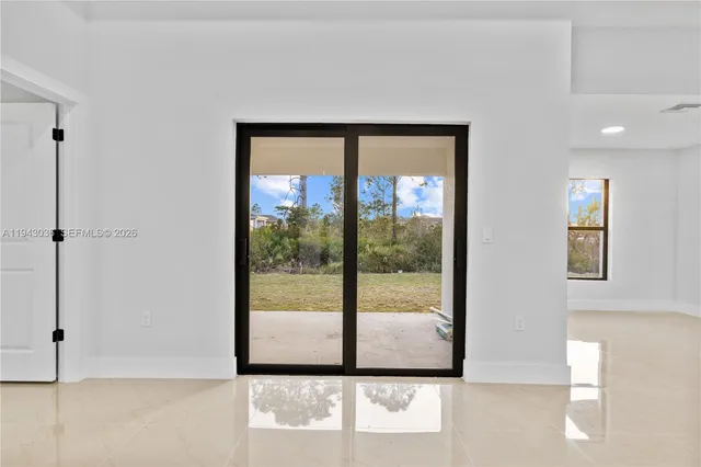 a view of a room that has a large window