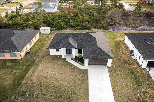a aerial view of a house with swimming pool
