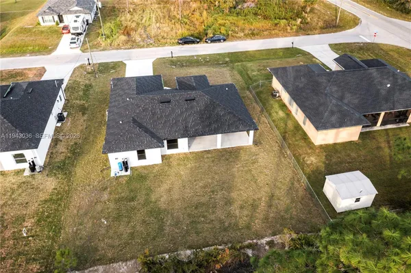a aerial view of a house with a yard