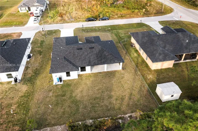 a aerial view of a house with a yard