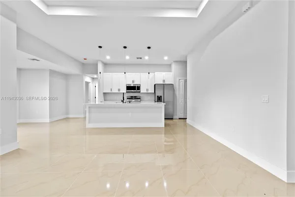 a view of a kitchen and windows