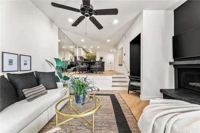 a living room with furniture and a fireplace