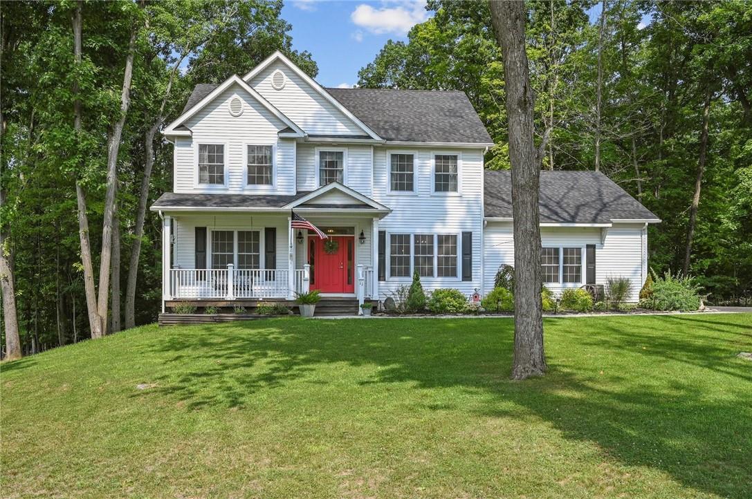 11 Gilmour Way Monroe, NY 10950 - Photo 1 of 1 a front view of a house with a garden