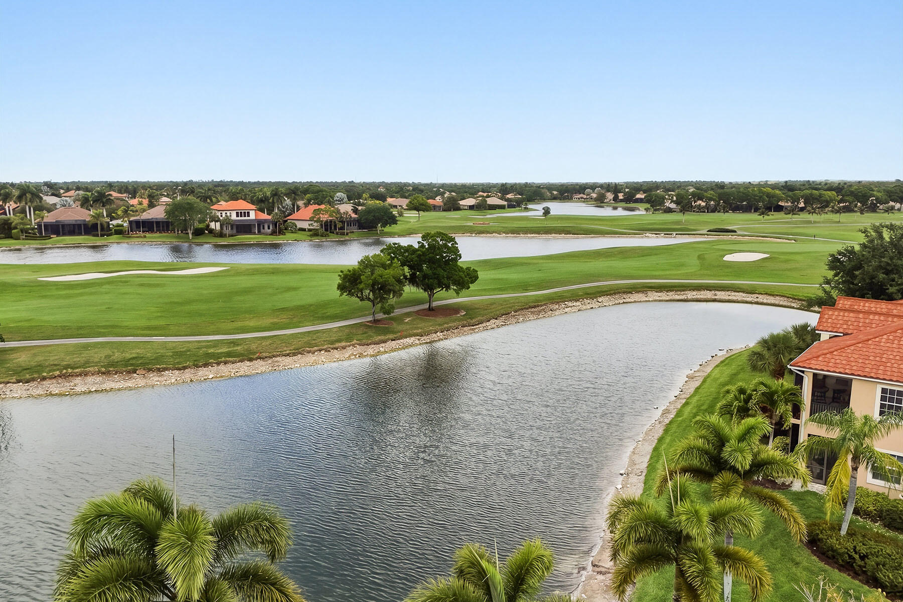 8605 Champions Point, Unit 103 Naples, FL 34113 - Photo 41 of 44 a view of a lake with a city
