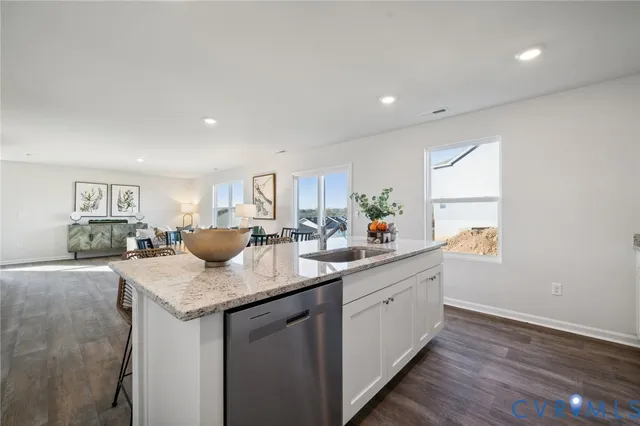 a kitchen with sink and window