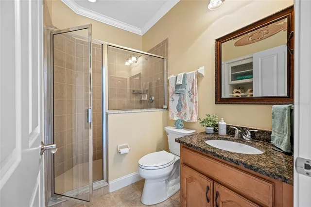 a kitchen with stainless steel appliances kitchen island granite countertop a refrigerator a stove a microwave oven a sink with a dining table and chairs