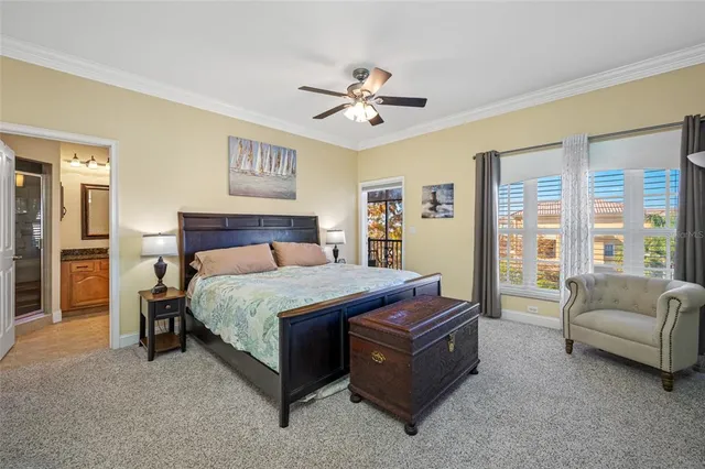 a bedroom with a bed a flat screen tv and dresser