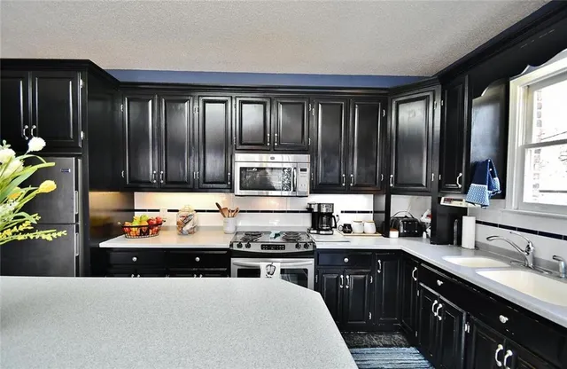 a kitchen with a dining table and chairs