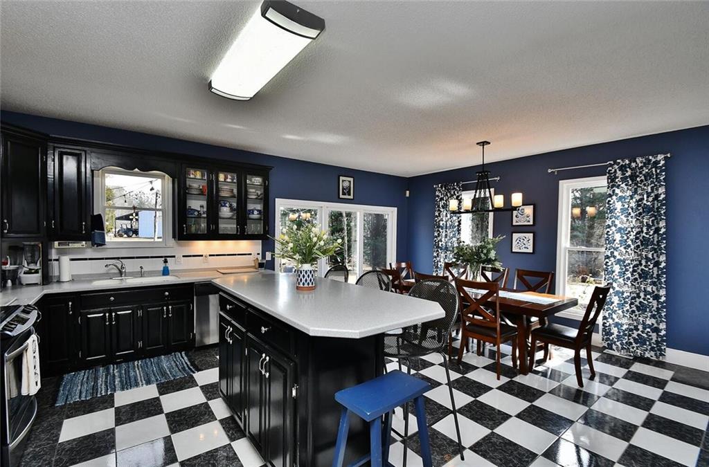 184 Scott Circle Toccoa, GA 30577 - Photo 15 of 52 a kitchen with a dining table and chairs
