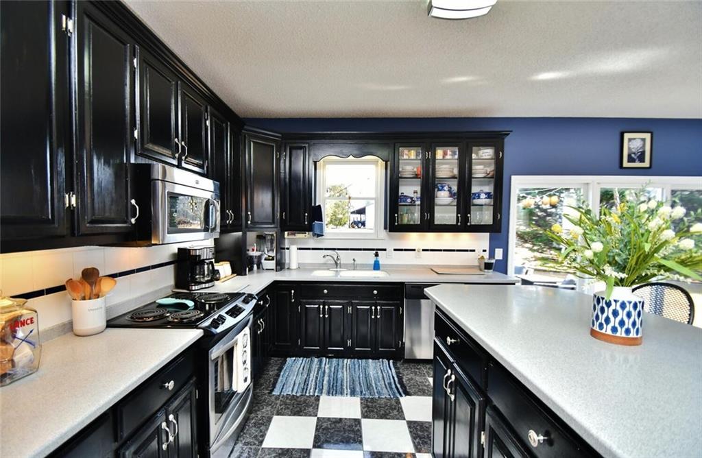 184 Scott Circle Toccoa, GA 30577 - Photo 16 of 52 a kitchen with a sink appliances and cabinets