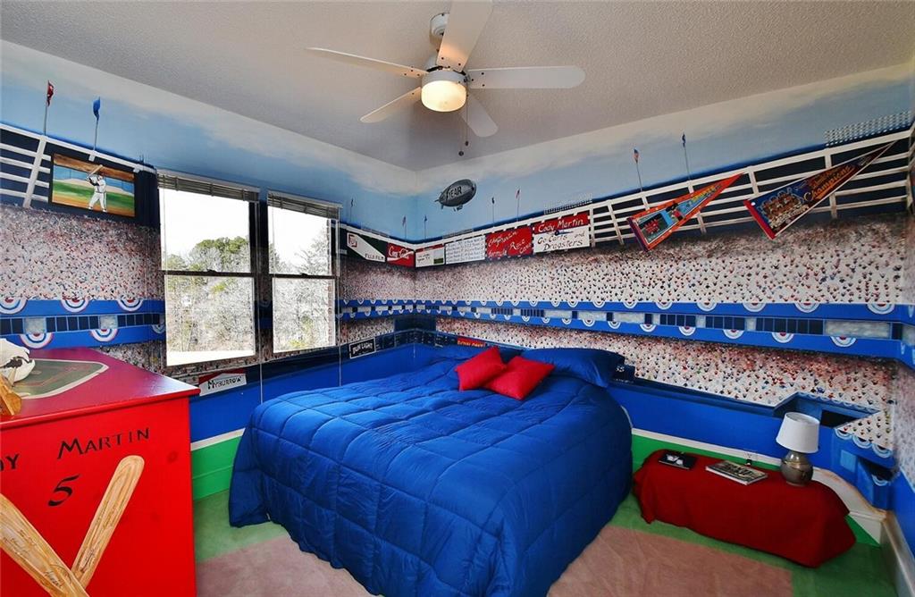 184 Scott Circle Toccoa, GA 30577 - Photo 20 of 52 a living room with blue lights with furniture and a flat screen tv