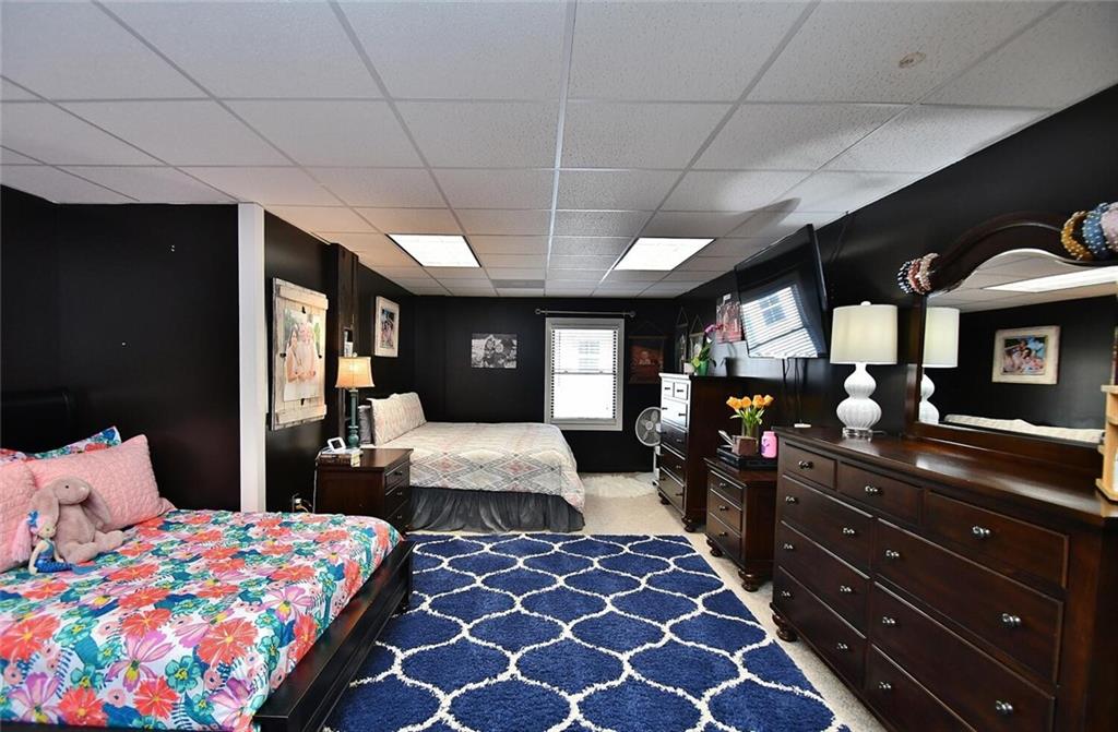 184 Scott Circle Toccoa, GA 30577 - Photo 22 of 52 a bedroom with a bed and wooden floor