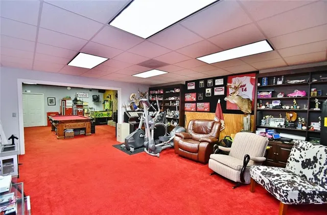 a garage with a couch and a chandelier